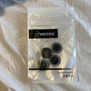 Four Black and White Thumb Button Covers for Nintendo Switch/Lite